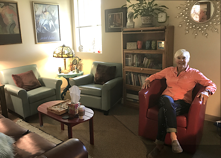Vicki seated in her office